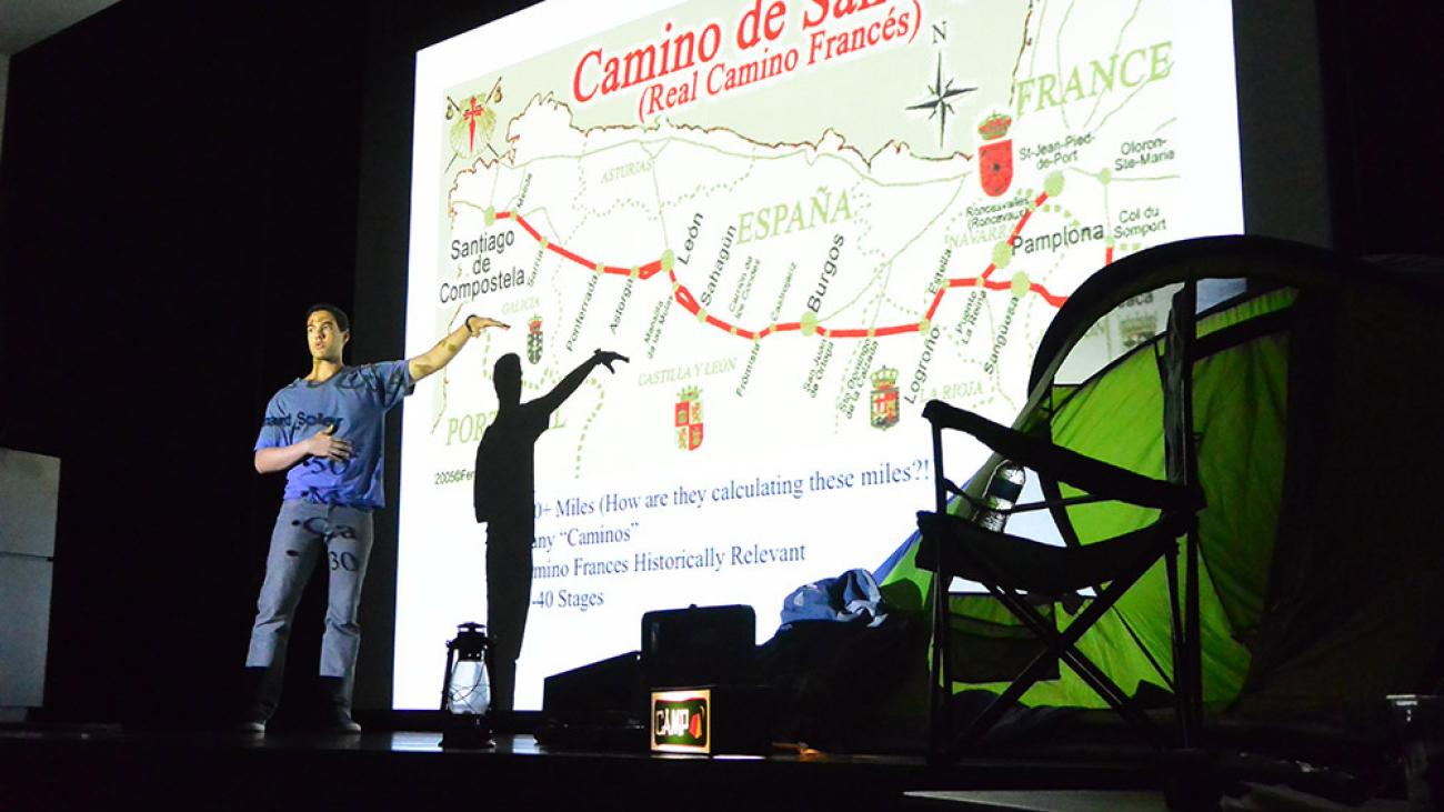 A student giving a presentation on Camino de Santiago